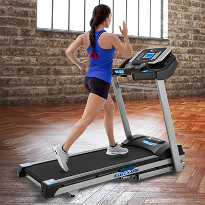 Woman with blonde hair running on the Xterra TRX2500 treadmill