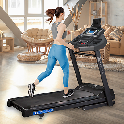 Woman with blonde hair running on the Xterra XT4000 treadmill