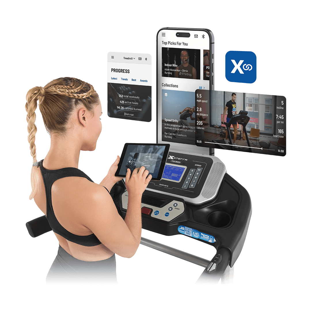 XF Connect woman using a device to interact with XF Connect App and her treadmill
